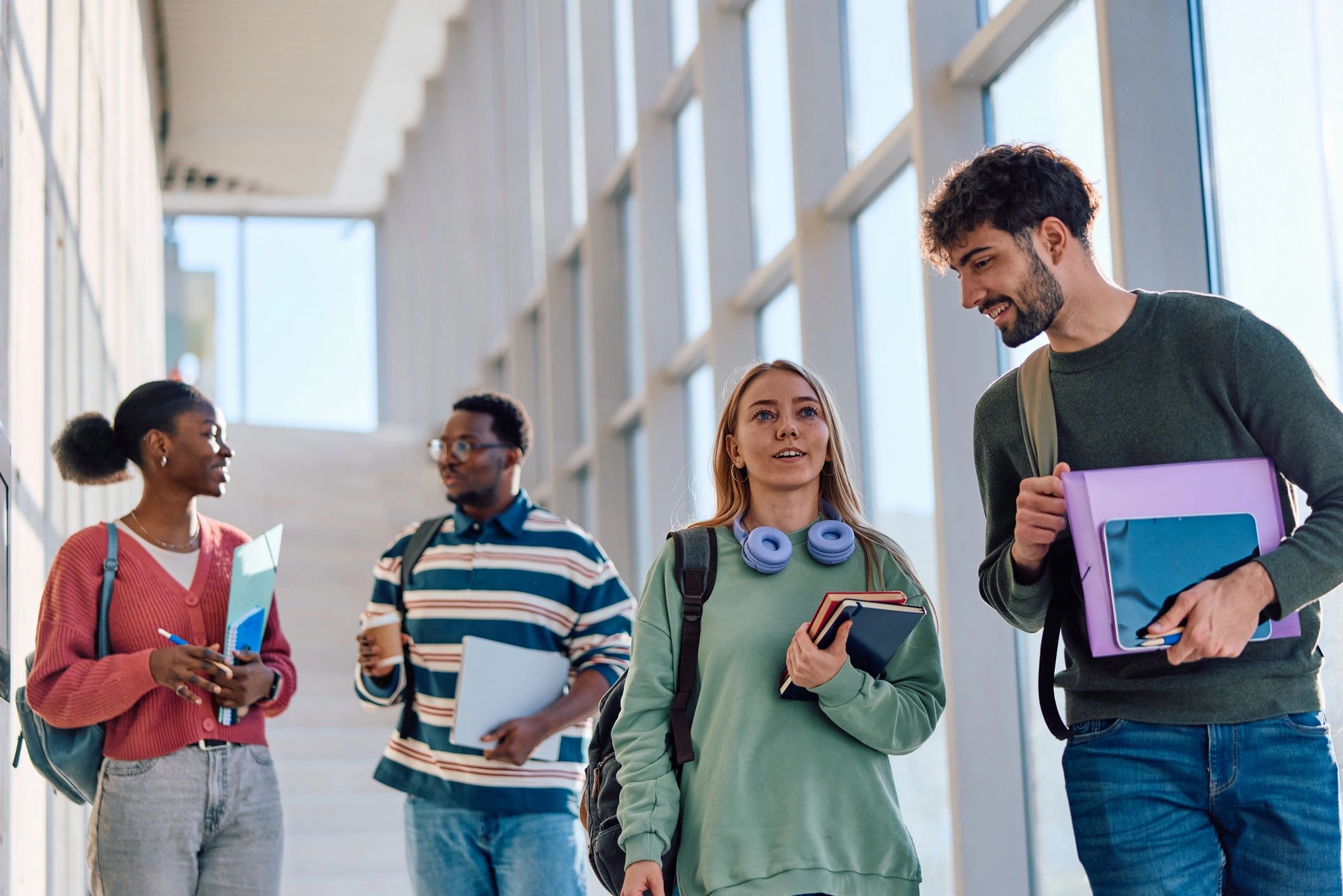 Students walking together in a university hallway